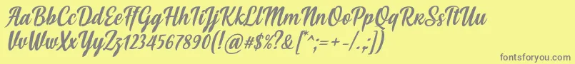 Fonte Soe Font by Situjuh 7NTypes – fontes cinzas em um fundo amarelo