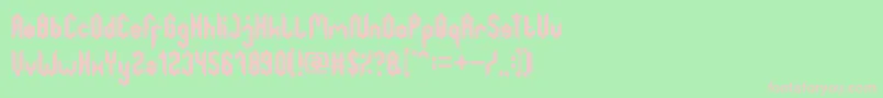 GreatestMap-Schriftart – Rosa Schriften auf grünem Hintergrund