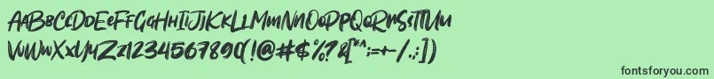 Шрифт Sombori demo – чёрные шрифты на зелёном фоне