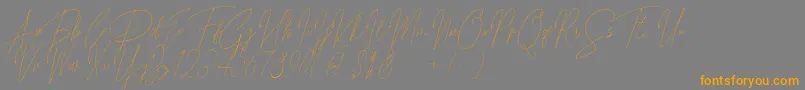 Songstar Free-fontti – oranssit fontit harmaalla taustalla