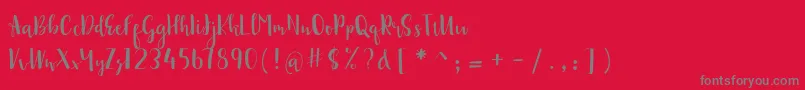 sonya demo-Schriftart – Graue Schriften auf rotem Hintergrund