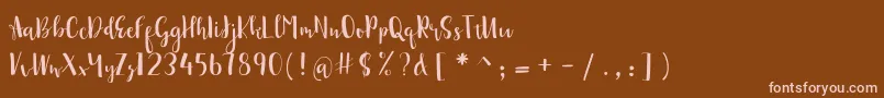sonya demo-Schriftart – Rosa Schriften auf braunem Hintergrund
