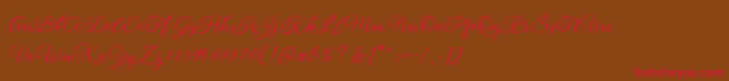 フォントSophia Script Free Demo – 赤い文字が茶色の背景にあります。