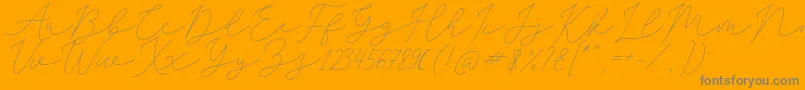 SophiaChristie-Schriftart – Graue Schriften auf orangefarbenem Hintergrund