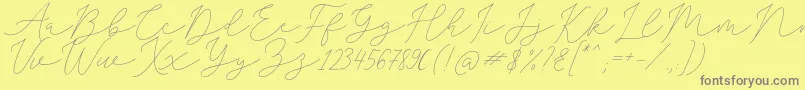 SophiaChristie-Schriftart – Graue Schriften auf gelbem Hintergrund