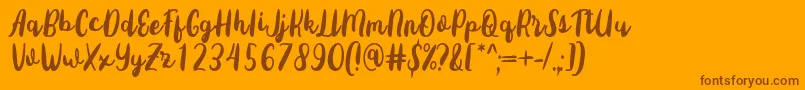 Sottee Font by Rifky 7NTypes Font – Brown Fonts on Orange Background