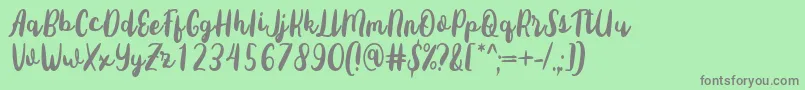 Fonte Sottee Font by Rifky 7NTypes – fontes cinzas em um fundo verde