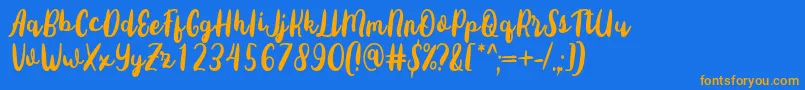 フォントSottee Font by Rifky 7NTypes – オレンジ色の文字が青い背景にあります。