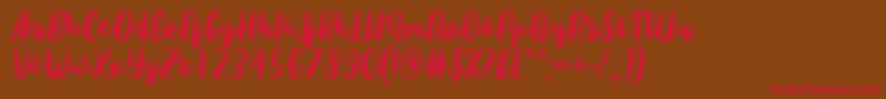 Sottee Font by Rifky 7NTypes Font – Red Fonts on Brown Background