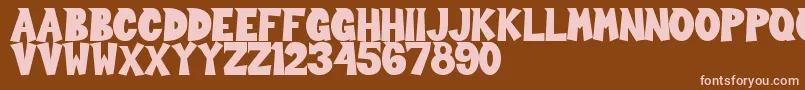 Sour Crunch-fontti – vaaleanpunaiset fontit ruskealla taustalla
