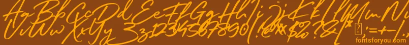 South Celebes Font Font – Orange Fonts on Brown Background
