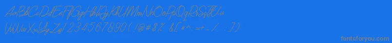 フォントSOUTHERN JAVANICA FREE – 青い背景に灰色の文字