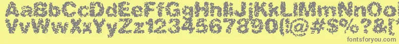 spastic2-Schriftart – Graue Schriften auf gelbem Hintergrund