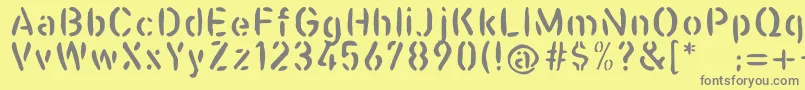 Casualstencil-Schriftart – Graue Schriften auf gelbem Hintergrund