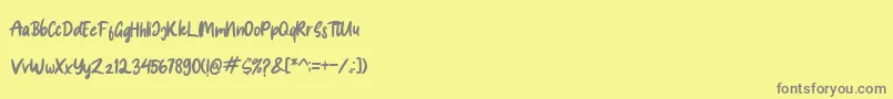 フォントSpice Girl – 黄色の背景に灰色の文字