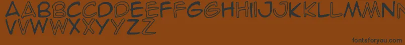 Fonte SpideRaY – fontes pretas em um fundo marrom