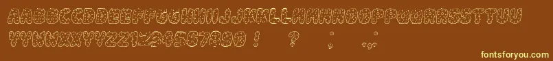 Spiky Italic-fontti – keltaiset fontit ruskealla taustalla