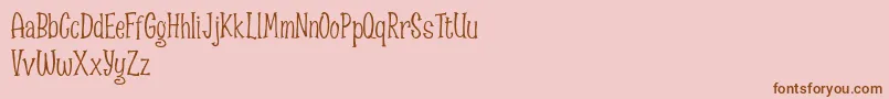 Fonte Spizzella Free font – fontes marrons em um fundo rosa