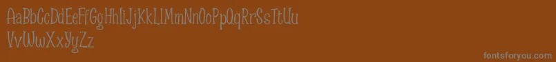 Spizzella Free font Font – Gray Fonts on Brown Background