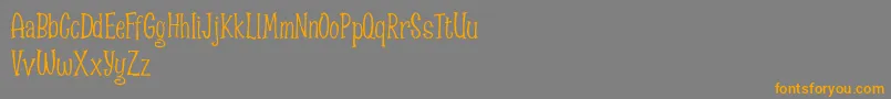 フォントSpizzella Free font – オレンジの文字は灰色の背景にあります。