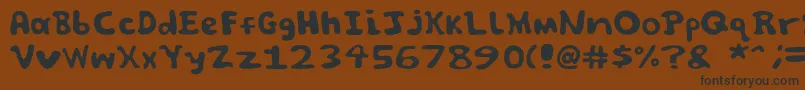 Czcionka Spooky font by Jammycreamer com – czarne czcionki na brązowym tle