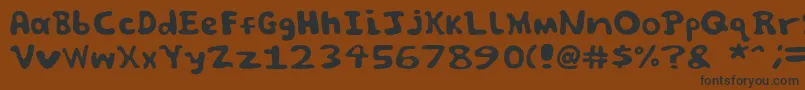 フォントSpooky font by Jammycreamer com – 黒い文字が茶色の背景にあります