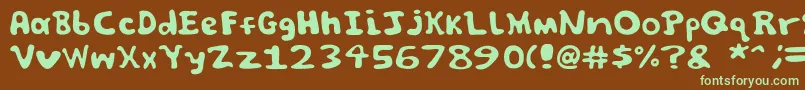 フォントSpooky font by Jammycreamer com – 緑色の文字が茶色の背景にあります。