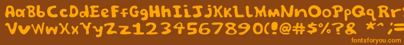 フォントSpooky font by Jammycreamer com – オレンジ色の文字が茶色の背景にあります。