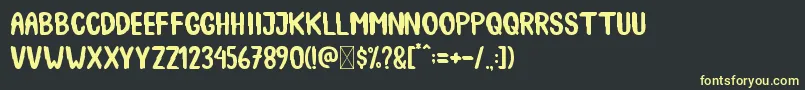 SpookyBooah Font – Yellow Fonts on Black Background