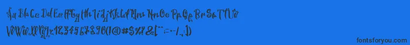 SpookyWookyRegular-Schriftart – Schwarze Schriften auf blauem Hintergrund