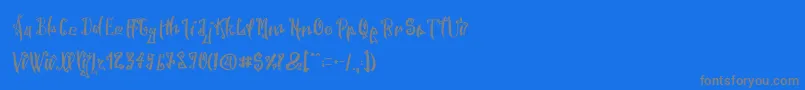 SpookyWookyRegular-Schriftart – Graue Schriften auf blauem Hintergrund