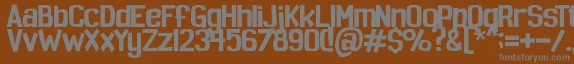 Spoopy-fontti – harmaat kirjasimet ruskealla taustalla