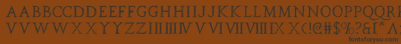 フォントspqr – 黒い文字が茶色の背景にあります