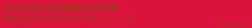 Spydolls demo-fontti – ruskeat fontit punaisella taustalla