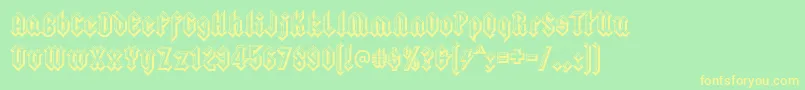 squealer embossed-Schriftart – Gelbe Schriften auf grünem Hintergrund