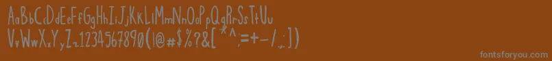 フォントSqwoze – 茶色の背景に灰色の文字