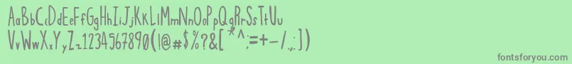 フォントSqwoze – 緑の背景に灰色の文字