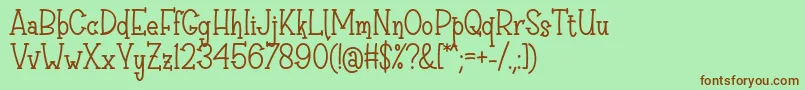 Czcionka Sri Muliyo Font by Rifki 7NTypes – brązowe czcionki na zielonym tle