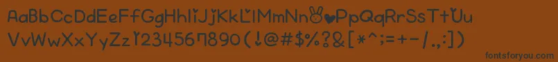 CheekyRabbit Font – Black Fonts on Brown Background