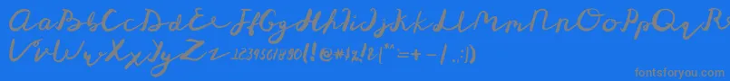 St Maknyus Font – Gray Fonts on Blue Background