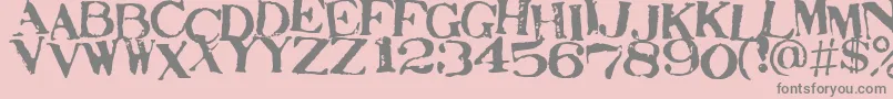 フォントSTAMAJ   – ピンクの背景に灰色の文字