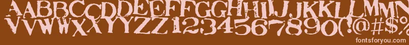 STAMAJ  -fontti – vaaleanpunaiset fontit ruskealla taustalla