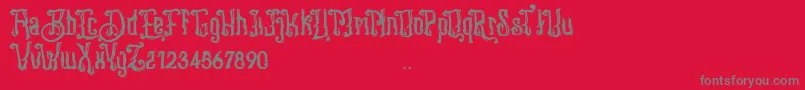 Fonte Stangbunder – fontes cinzas em um fundo vermelho
