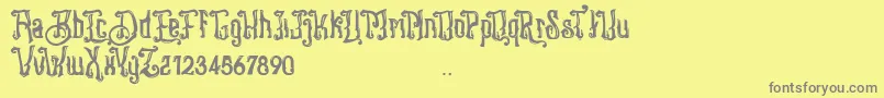 Stangbunder-Schriftart – Graue Schriften auf gelbem Hintergrund