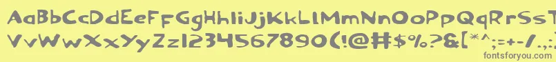 フォントOzymandiasExpanded – 黄色の背景に灰色の文字