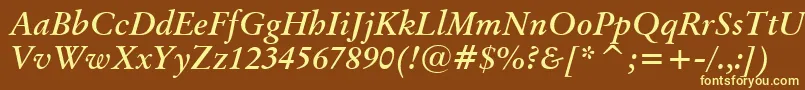 BaramondBoldItalic-fontti – keltaiset fontit ruskealla taustalla