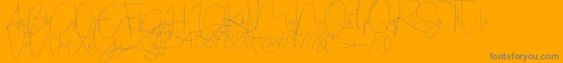 Stealletto-Schriftart – Graue Schriften auf orangefarbenem Hintergrund