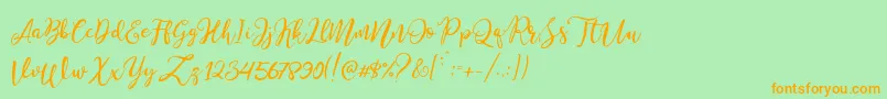Stella Wilson Font – Orange Fonts on Green Background