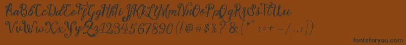 Шрифт Stellanova Script Free Demo – чёрные шрифты на коричневом фоне