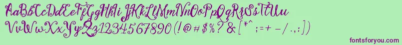 Stellanova Script Free Demo-fontti – violetit fontit vihreällä taustalla